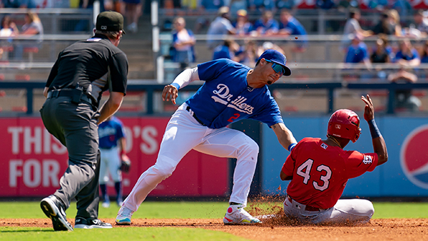 Leonel Valera of the Tulsa Drillers tags out former Tulsa Driller Errol Robinson