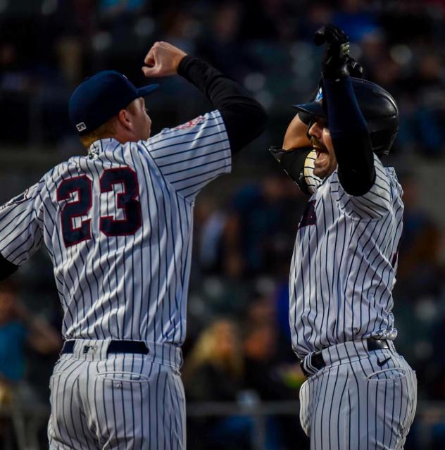 Somerset Patriots' Austin Wells and Eric Wagaman celebrate win