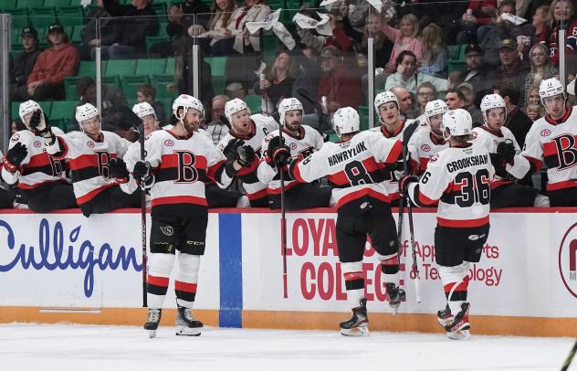 Belleville Senators' Jayce Hawryluk and Angus Crookshank congratulate teammates
