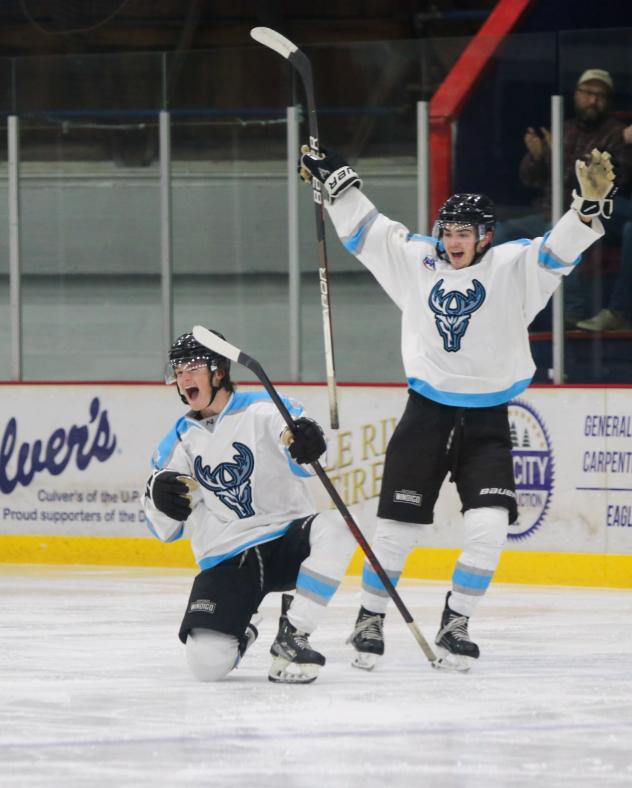 Cashen Naeve (#23) celebrates with Wisconsin Windigo teammate Sam Jacobs (back)
