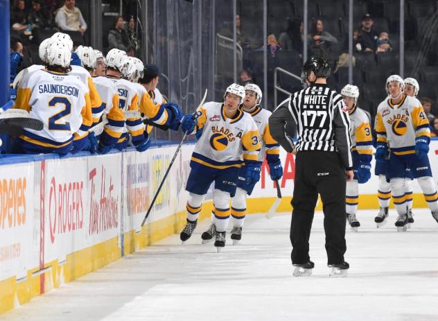 Trevor Wong of the Saskatoon Blades congratulating teammates