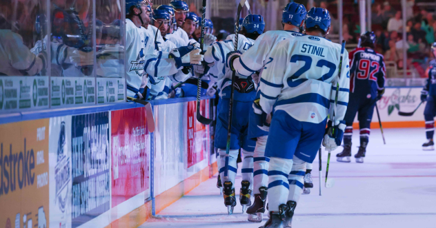 Wichita Thunder exchange high fives along the bench
