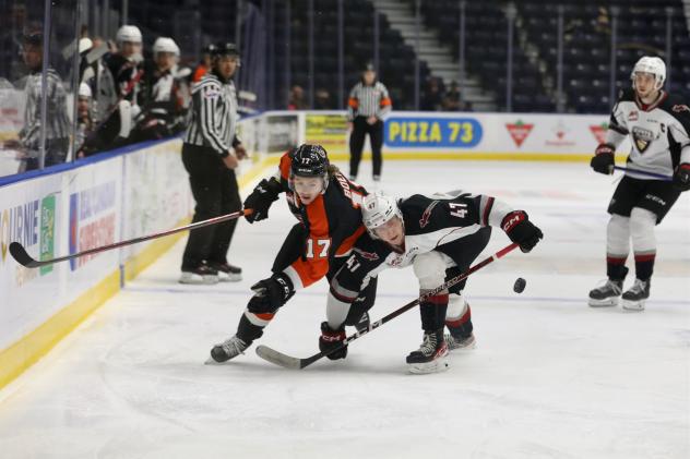 Vancouver Giants' Mazden Leslie and Medicine Hat Tigers' Brayden Boehm in action