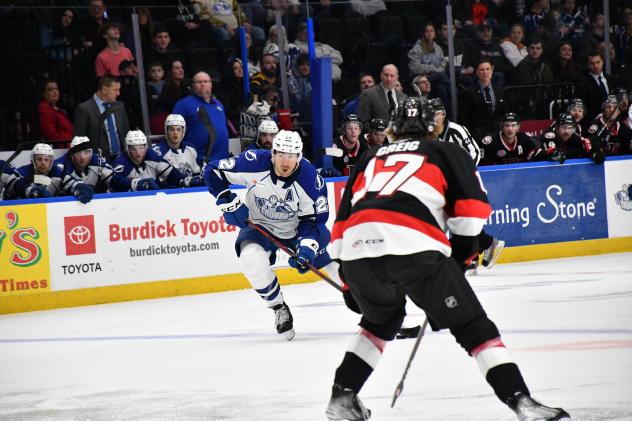 Belleville Senators' Ridly Greig and Syracuse Crunch's P.C. Labrie on the ice