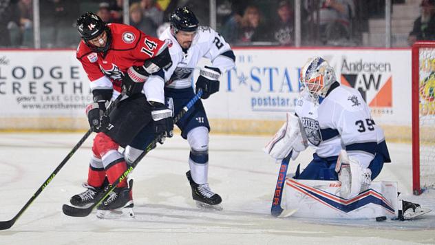 Worcester Railers' Myles McGurty and Ken Appleby battle Adirondack Thunder's Vladislav Mikhalchuk