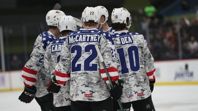 Tucson Roadrunners' Ben McCartney, Jean-Sebastien Dea and Michael Carcone on the ice