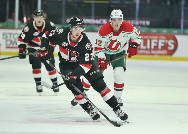 Belleville Senators' Jarid Lukosevicius and Cole Reinhardt with Utica Comets' Tyce Thompson on the ice