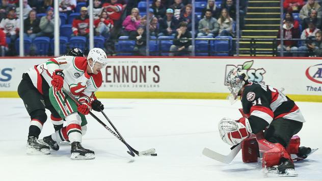 Utica Comets' Andreas Johnsson battles Belleville Senators' Kevin Mandolese