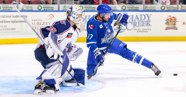 Tulsa Oilers' Colten Ellis and Wichita Thunder's Stefan Fournier on the ice