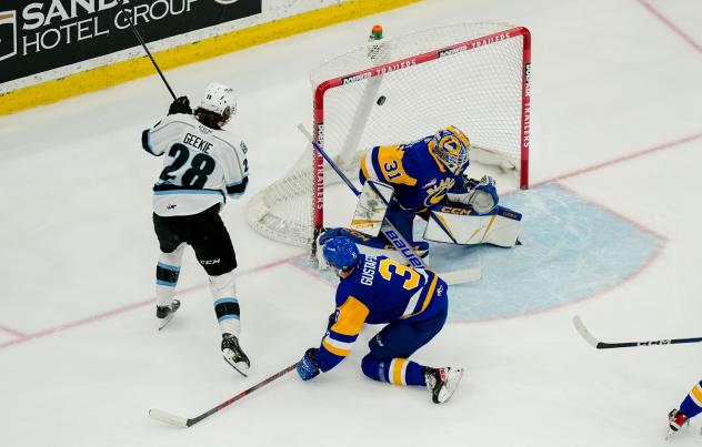 Winnipeg ICE's Conor Geekie battles Saskatoon Blades' Blake Gustafson and Austin Elliott