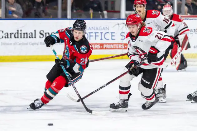 Kelowna Rockets left wing Andrew Cristall (left)