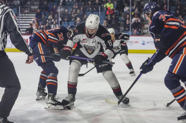 Owen Hardy of the Vancouver Giants battles Kamloops Blazers' Drew Englot