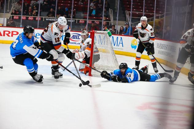 Lehigh Valley Phantoms' Ronnie Attard battles Grigori Denisenko of the Charlotte Checkers