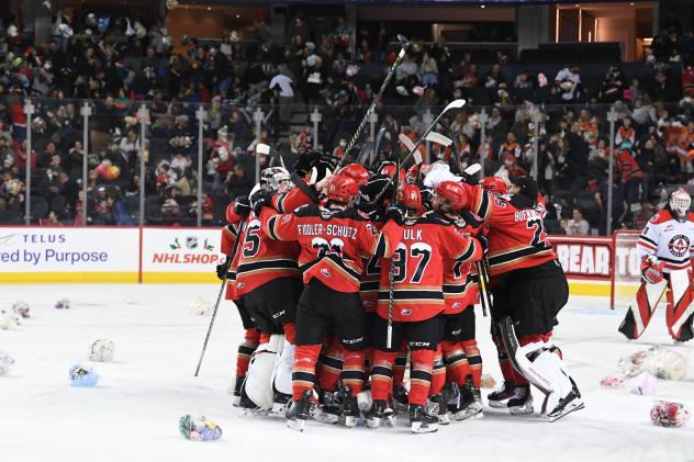 Calgary Hitmen celebrate after the 2022 ENMAX Teddy Bear Toss goal