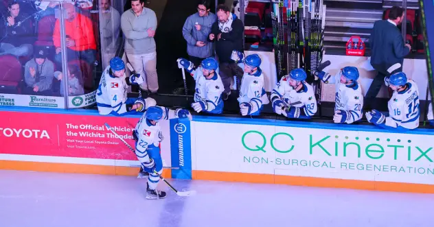 Wichita Thunder forward Michal Stinil receives high fives from the bench