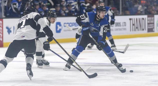 Saint John Sea Dogs' Connor Trenholm and Blainville-Boisbriand Armada's Zach Biggar in action