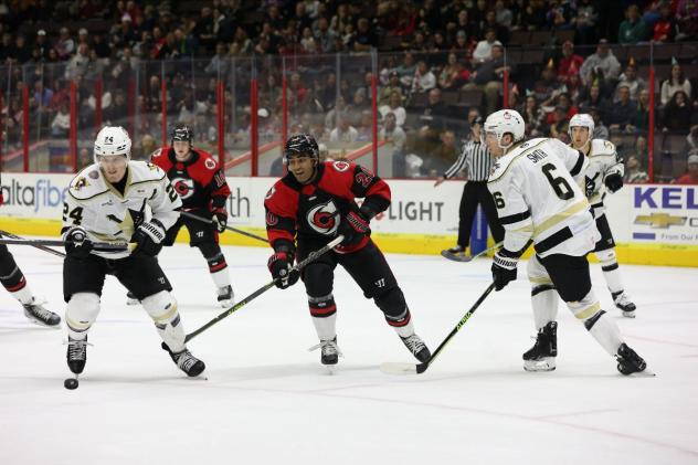 Cincinnati Cyclones' Arvin Atwal And Wheeling Nailers' Adam Smith And Josh Maniscalco On The Ice