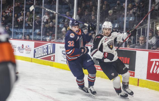 Kamloops Blazers' Drew Englot and Vancouver Giants' Carson Haynes in action