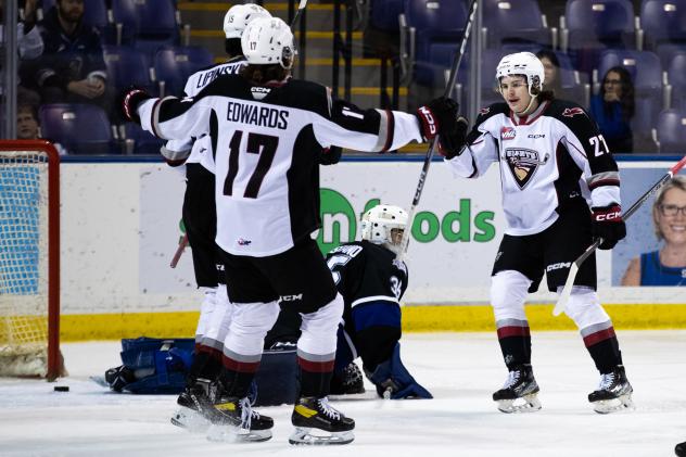 Vancouver Giants' Matthew Edwards and Dylan Anderson celebrate win