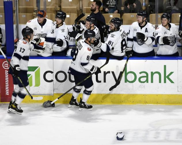 Worcester Railers forwards Bobby Butler (8) and Blade Jenkins receive high fives from the bench