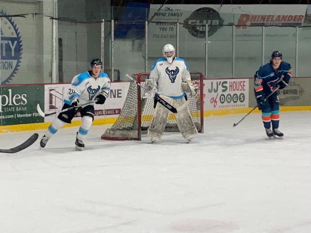 Wisconsin Windigo goaltender Gavin Moffat and Paul Huglen defend the net