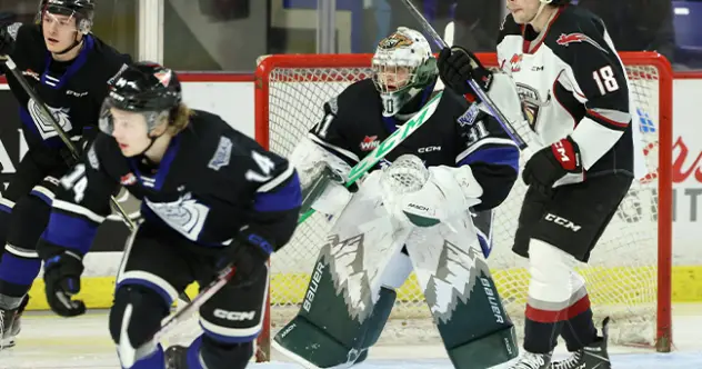 Victoria Royals' Carter Dereniwsky and Braden Holt and Vancouver Giants' Colton Langkow