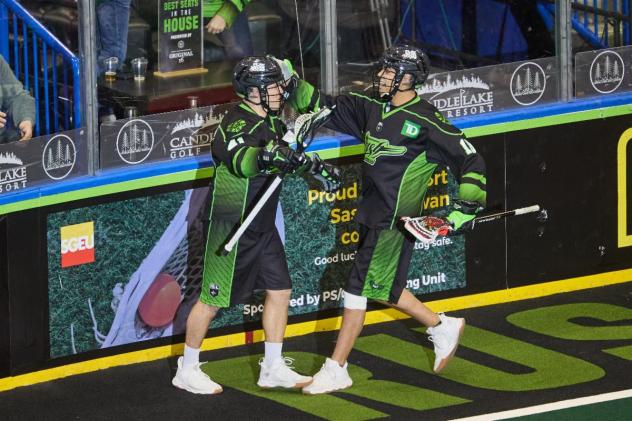 Saskatchewan Rush exchange congratulations after a goal