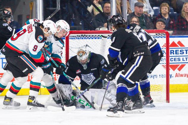 Kelowna Rockets' Marcus Pacheco and Victoria Royals' Braden Holt, Brayden Schuurman and Jason Spizawka in action