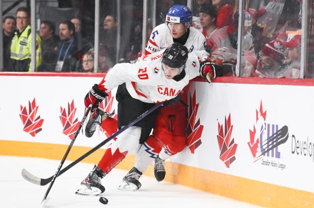 Team Canada's Zach Ostapchuk battles Team Czechia's David Jiricek