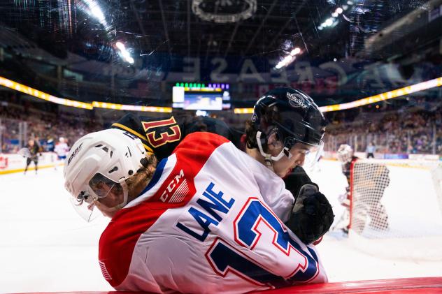 Vancouver Giants' Damian Palmieri battles Spokane Chiefs' Grady Lane