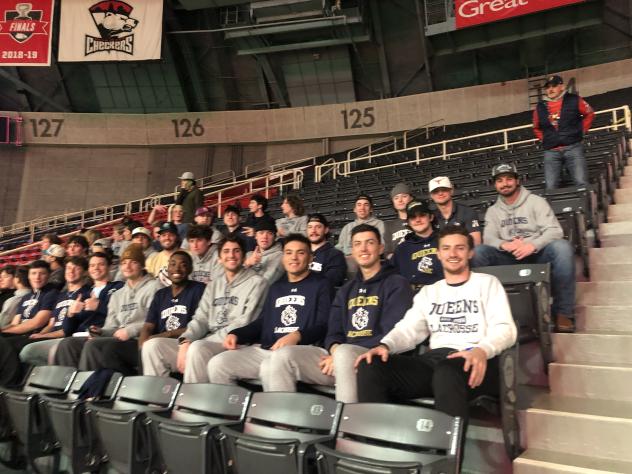 Lacrosse players from Queens University watch the Charlotte Bootleggers