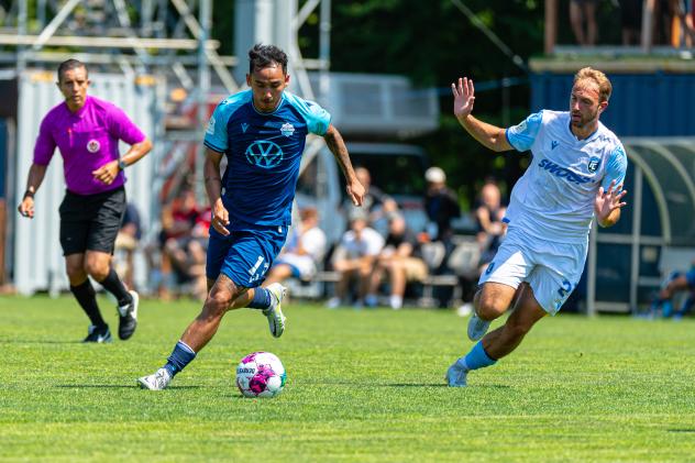 Halifax Wanderers midfielder Aidan Daniels (left)