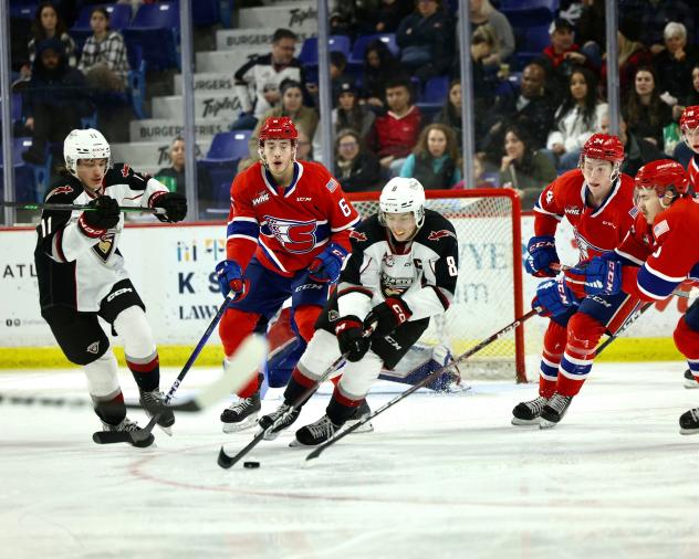 Spokane Chiefs' Mac Gross and Vancouver Giants' Ty Thorpe in action