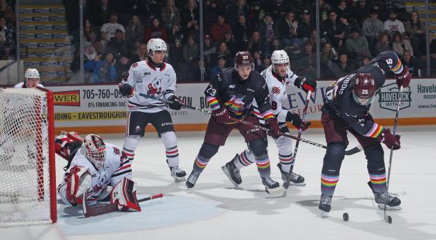 Peterborough Petes' Jonathan Melee and Jax Dubois battle the Niagara IceDogs