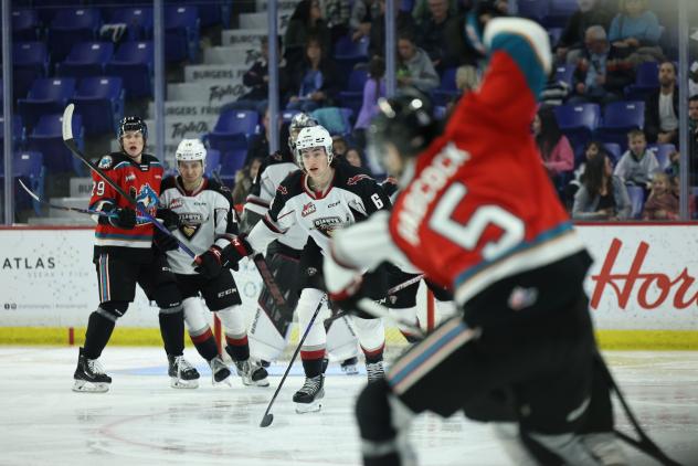 Kelowna Rockets' John Babcock and Vancouver Giants' Colton Roberts on game night