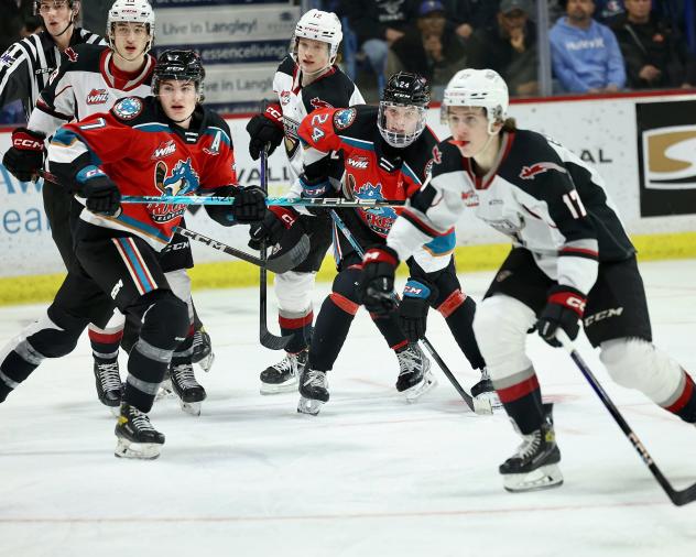 Kelowna Rockets' Max Graham and Dylan Wightman versus Vancouver Giants' Matthew Edwards