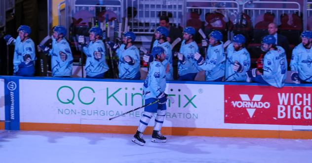 Wichita Thunder exchange congratulations along the bench