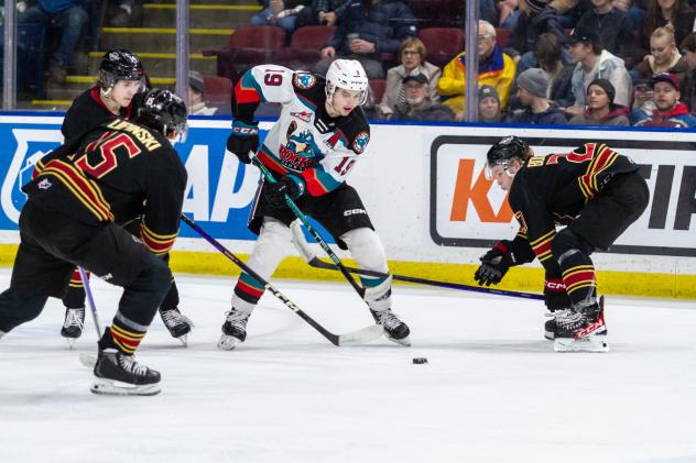 Kelowna Rockets left wing Adam Kydd handles the puck