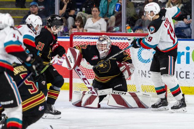 Kelowna Rockets' Adam Kydd battles Vancouver Giants' Brett Mirwald