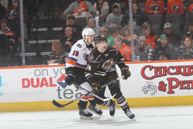 Lehigh Valley Phantoms' Isaac Ratcliffe and Hershey Bears' Riley Sutter in action