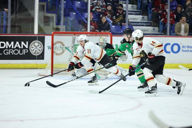 Vancouver Giants' Skyler Bruce Bruce and Ethan Semeniuk in action