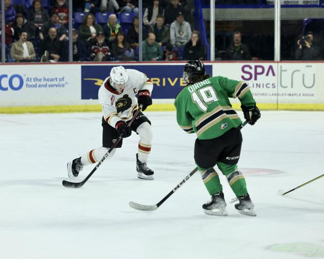 Vancouver Giants' Zack Ostapchuk and Prince Albert Raiders' Aiden Oiring on game night