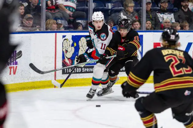 Kelowna Rockets left wing Carson Golder battles the Vancouver Giants