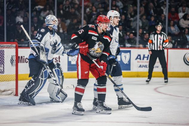 Manitoba Moose's Arvid Holm and Grand Rapids Griffins' Jakub Vrana on the ice