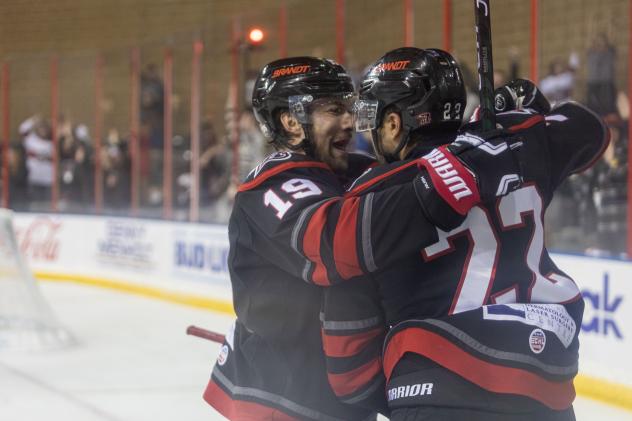 Rapid City Rush's Calder Brooks and Matthew Marcinew celebrate win