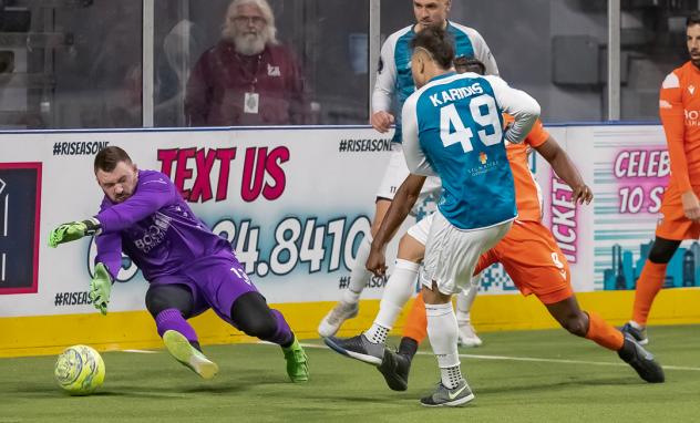 Florida Tropics goalkeeper Chris Frederick makes a diving save attempt