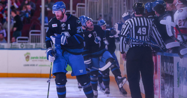 Wichita Thunder exchange congratulations along the bench