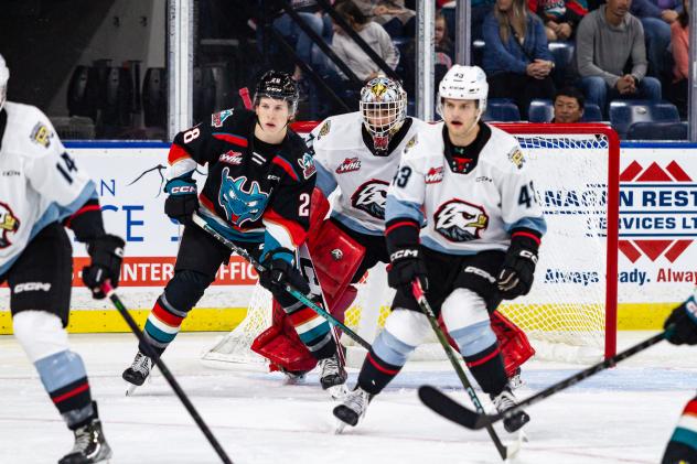 Kelowna Rockets right wing Andrew Cristall (left) vs. the Portland Winterhawks