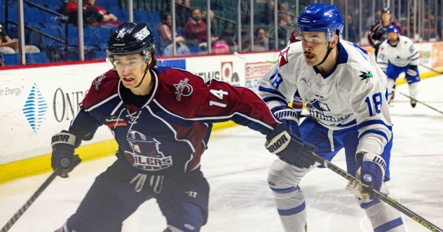 Wichita Thunder forward Chris Van Os-Shaw (right) vs. the Tulsa Oilers