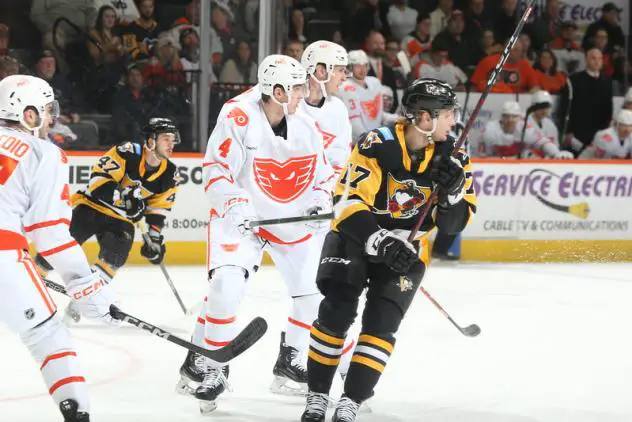 Lehigh Valley Phantoms' Egor Zamula and Wilkes-Barre/Scranton Penguins' Raivis Ansons in action